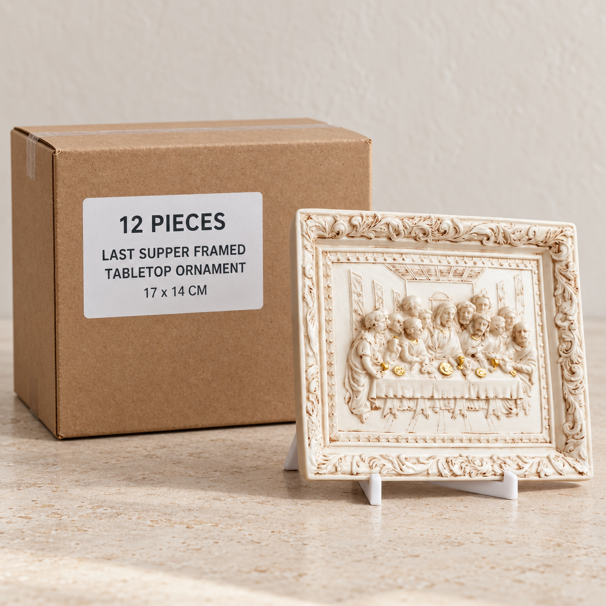 Last Supper Framed Tabletop Ornament — Box of 12 — 12 × Last Supper Framed Tabletop Ornament. Representative samples beside illustrative wholesale carton.