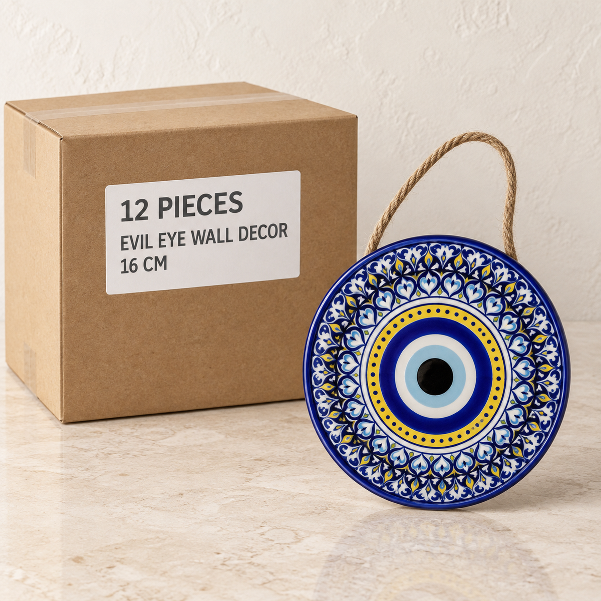 Evil Eye Wall Decor - 16 cm — Box of 12 — 12 × Evil Eye Wall Decor - 16 cm. Representative samples beside illustrative wholesale carton.