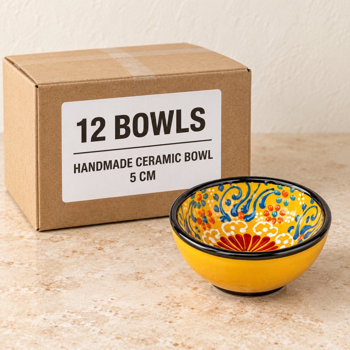 Handmade Ceramic Bowls — Box of 12 — 12 × Handmade Ceramic Bowl - 5 cm. Representative samples beside illustrative wholesale carton.