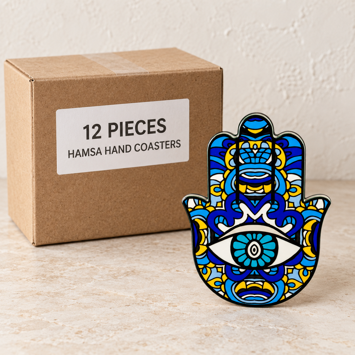 Hamsa Hand Coasters — Box of 12 — 12 × Hamsa Hand Coasters. Representative samples beside illustrative wholesale carton.