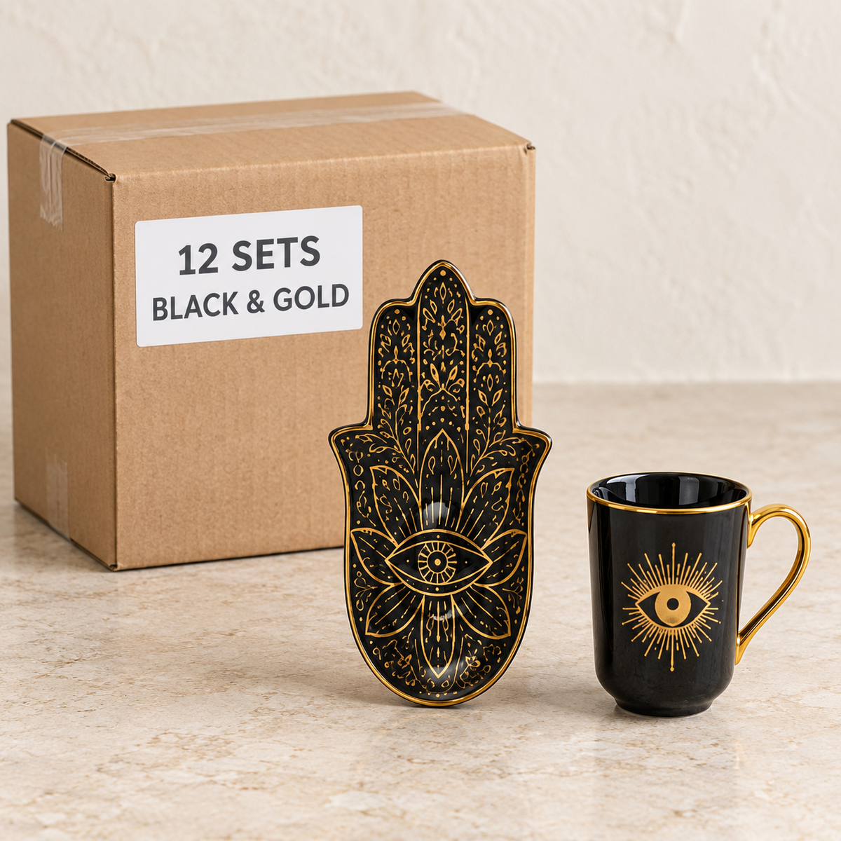 Evil Eye Mugs with Hamsa Trays — Box of 12 — 12 × Black & Gold. Representative samples beside illustrative wholesale carton.