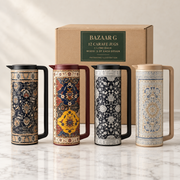 Four actual patterned 1 litre carafe designs representing a mixed wholesale box of 12, three of each design; carton is illustrative