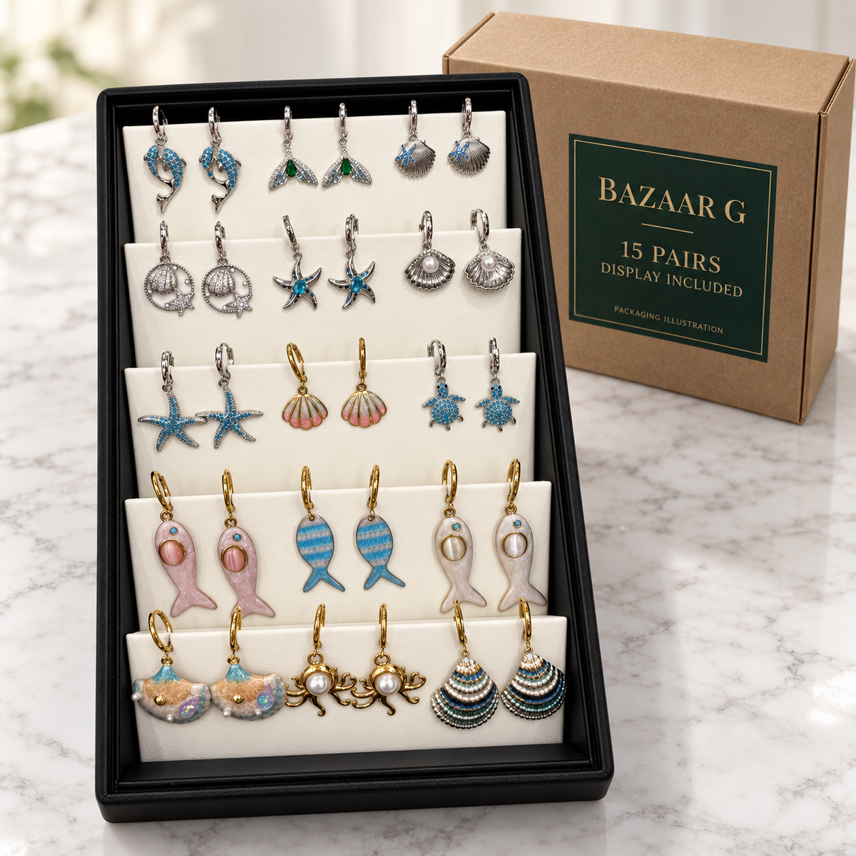 15 pairs of ocean and sea-life earrings in the included display tray beside an illustrative wholesale carton