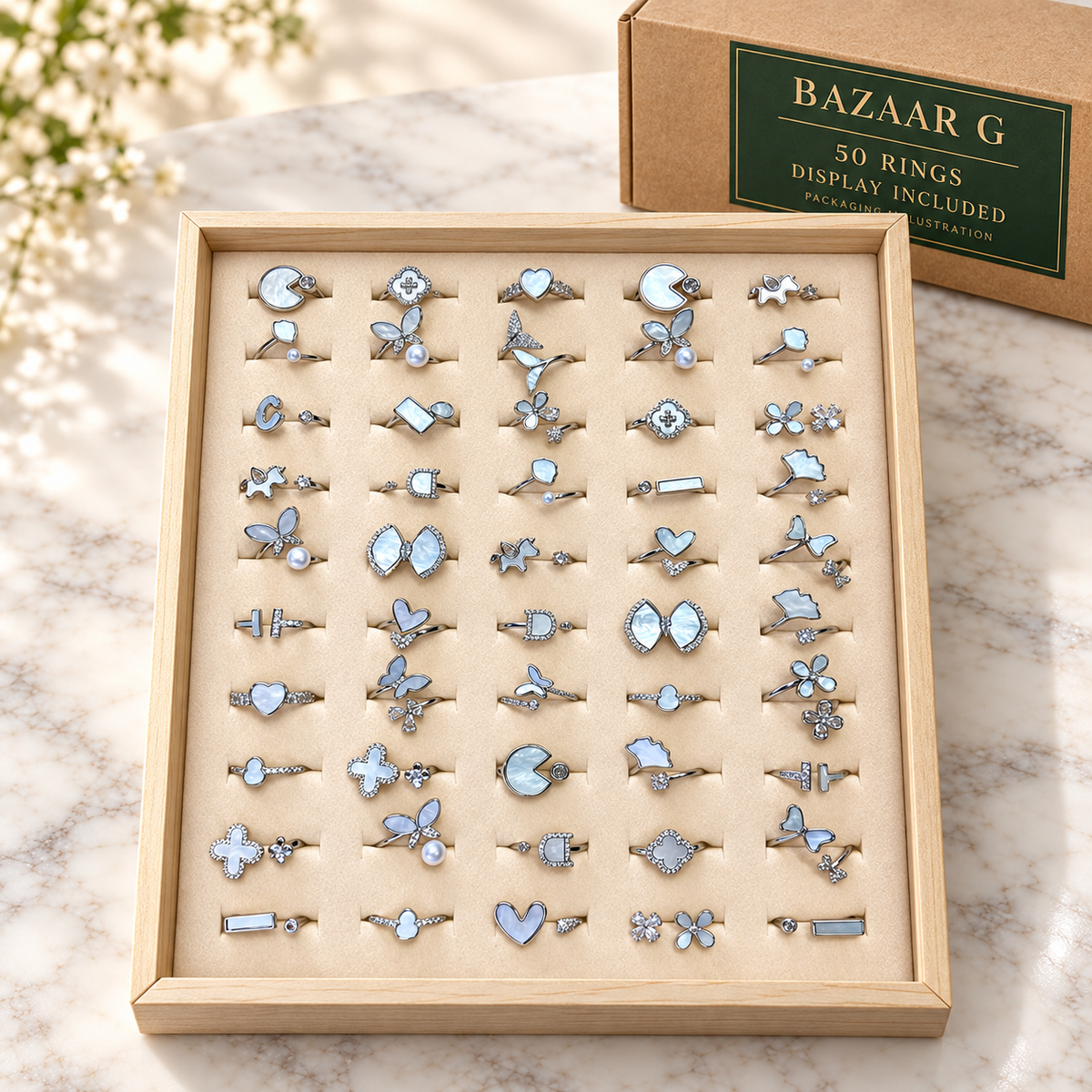 50 pearlescent motif rings in the included wooden display tray