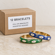 Bracelets — Box of 12 — 12 × Evil Eye Bracelets - Assorted Designs. Representative samples beside illustrative wholesale carton.