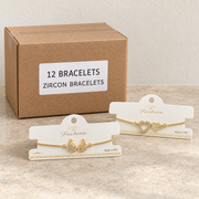 Bracelets — Box of 12 — 12 × Zircon Bracelets. Representative samples beside illustrative wholesale carton.