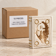 Holy Bible Cross Tabletop Ornament — Box of 12 — 12 × Holy Bible Cross Tabletop Ornament. Representative samples beside illustrative wholesale carton.