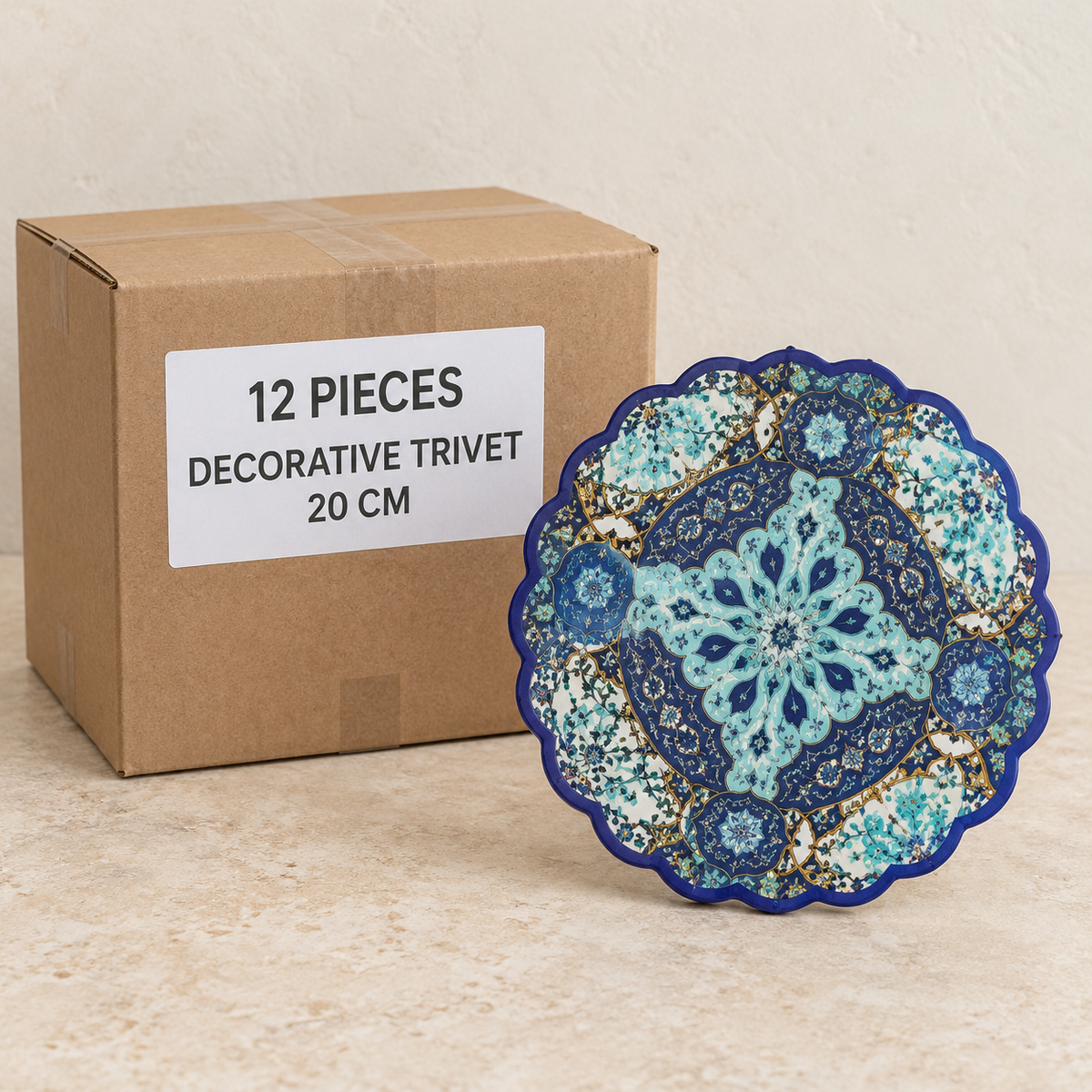 Decorative Trivet - 20 cm — Box of 12 — 12 × Decorative Trivet - 20 cm. Representative samples beside illustrative wholesale carton.