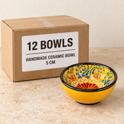 Handmade Ceramic Bowls — Box of 12 — 12 × Handmade Ceramic Bowl - 5 cm. Representative samples beside illustrative wholesale carton.