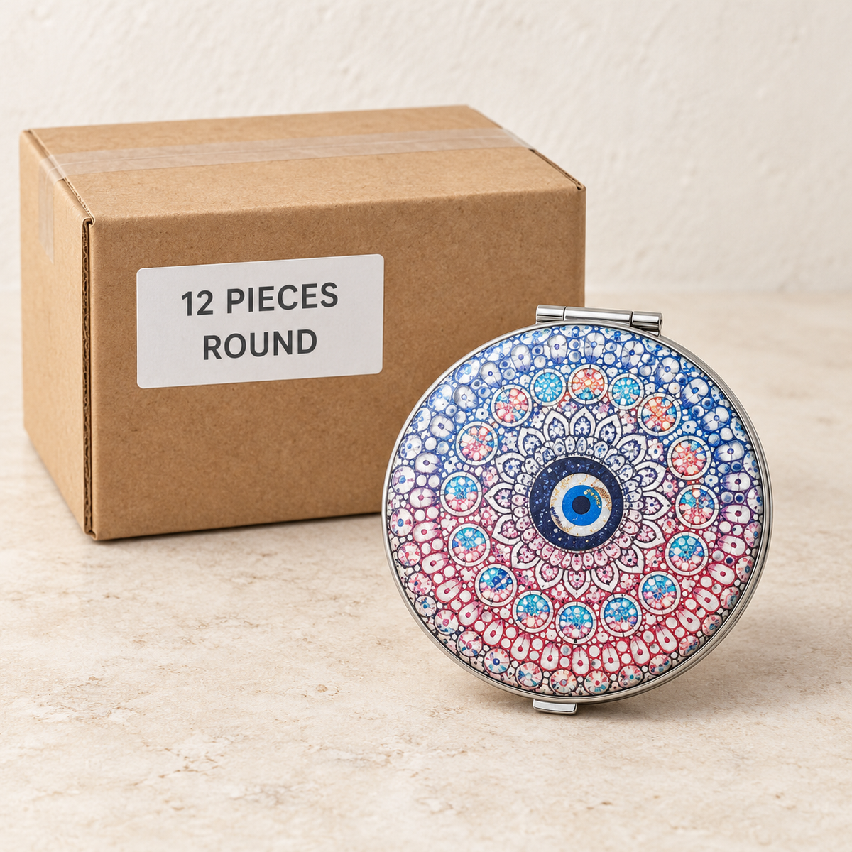 Decorative Compact Mirrors — Box of 12 — 12 × Round. Representative samples beside illustrative wholesale carton.