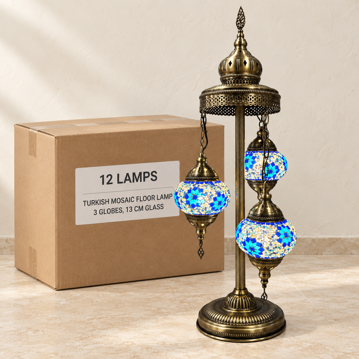 Mosaic Floor Lamps — Box of 12 — 12 × Turkish Mosaic Floor Lamp - 3 Globes, 13 cm Glass. Representative samples beside illustrative wholesale carton.