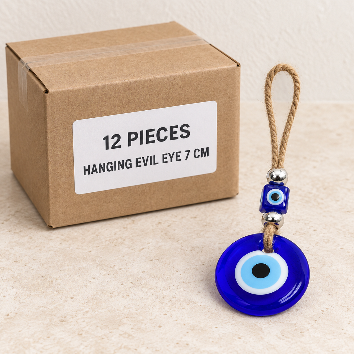 Hanging Evil Eyes — Box of 12 — 12 × Hanging Evil Eye - 7 cm. Representative samples beside illustrative wholesale carton.