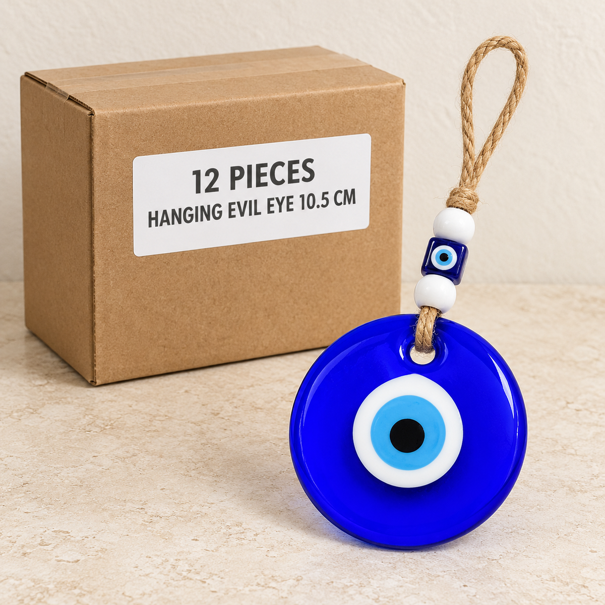 Hanging Evil Eyes — Box of 12 — 12 × Hanging Evil Eye - 10.5 cm. Representative samples beside illustrative wholesale carton.
