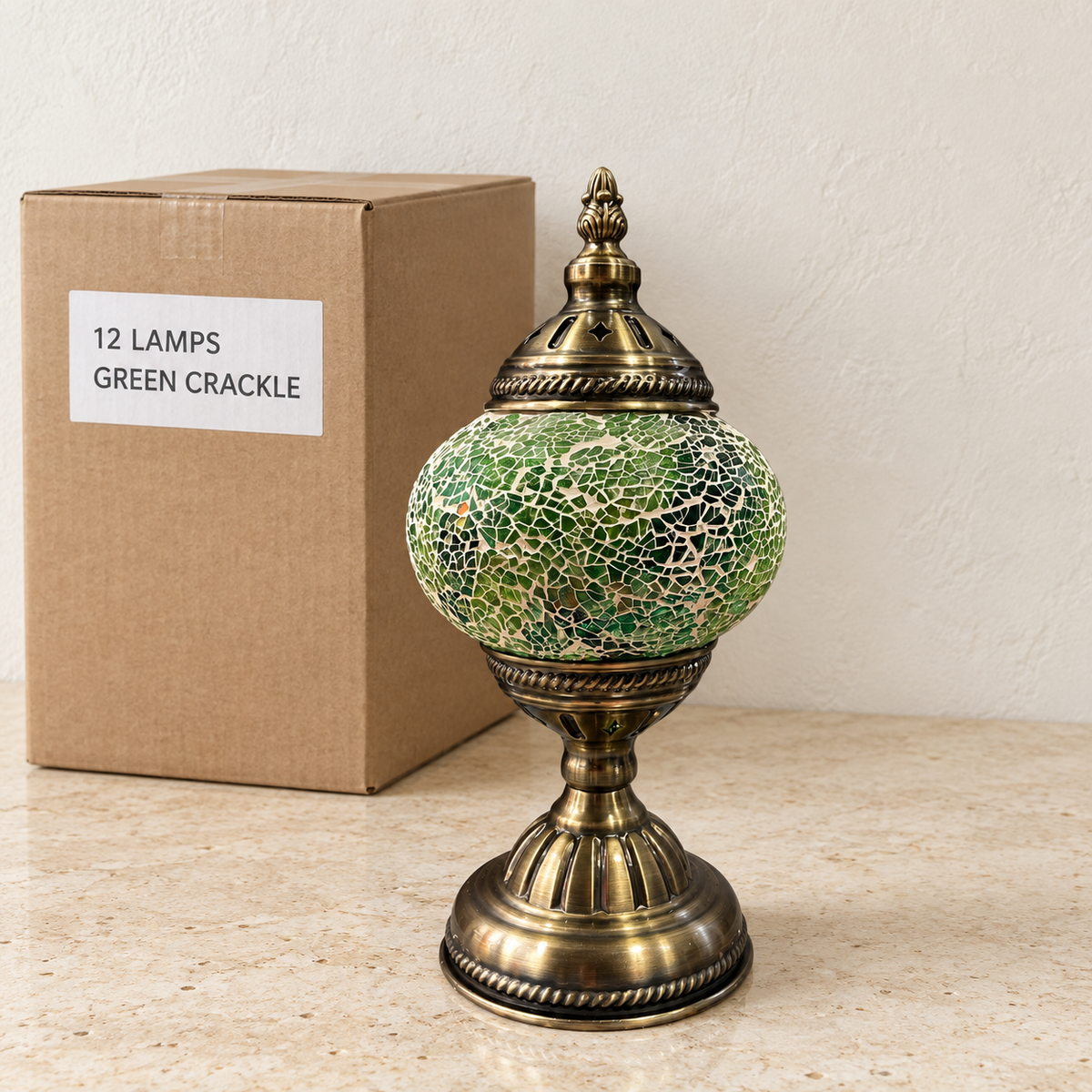 Green Crackle mosaic table lamp, based on the original Bazaar G retail product photo. One sample shown; wholesale box contains 12 of this design. Carton illustration.