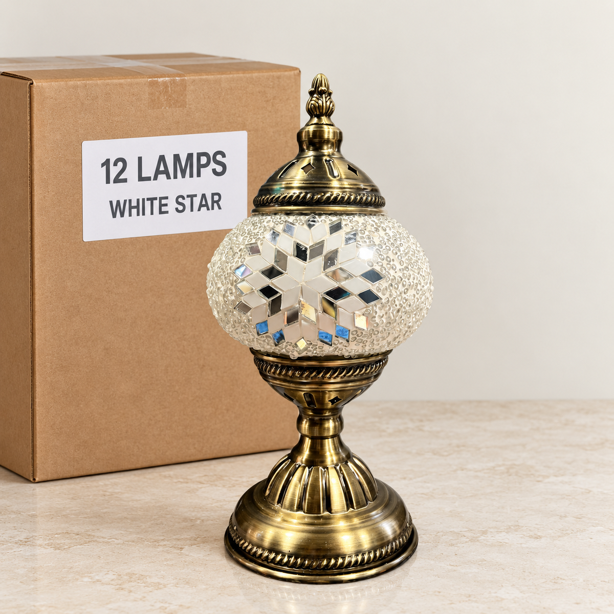 White Star mosaic table lamp, based on the original Bazaar G retail product photo. One sample shown; wholesale box contains 12 of this design. Carton illustration.