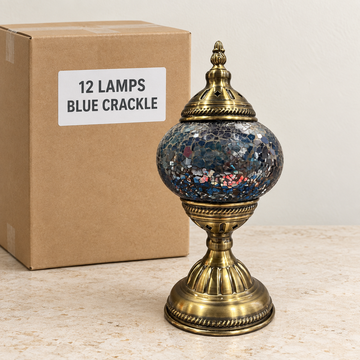 Blue Crackle mosaic table lamp, based on the original Bazaar G retail product photo. One sample shown; wholesale box contains 12 of this design. Carton illustration.