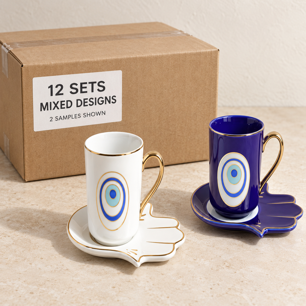 Evil Eye Mugs with Hamsa Trays — Box of 12 — Mixed box — 4 of each design. Representative samples beside illustrative wholesale carton.