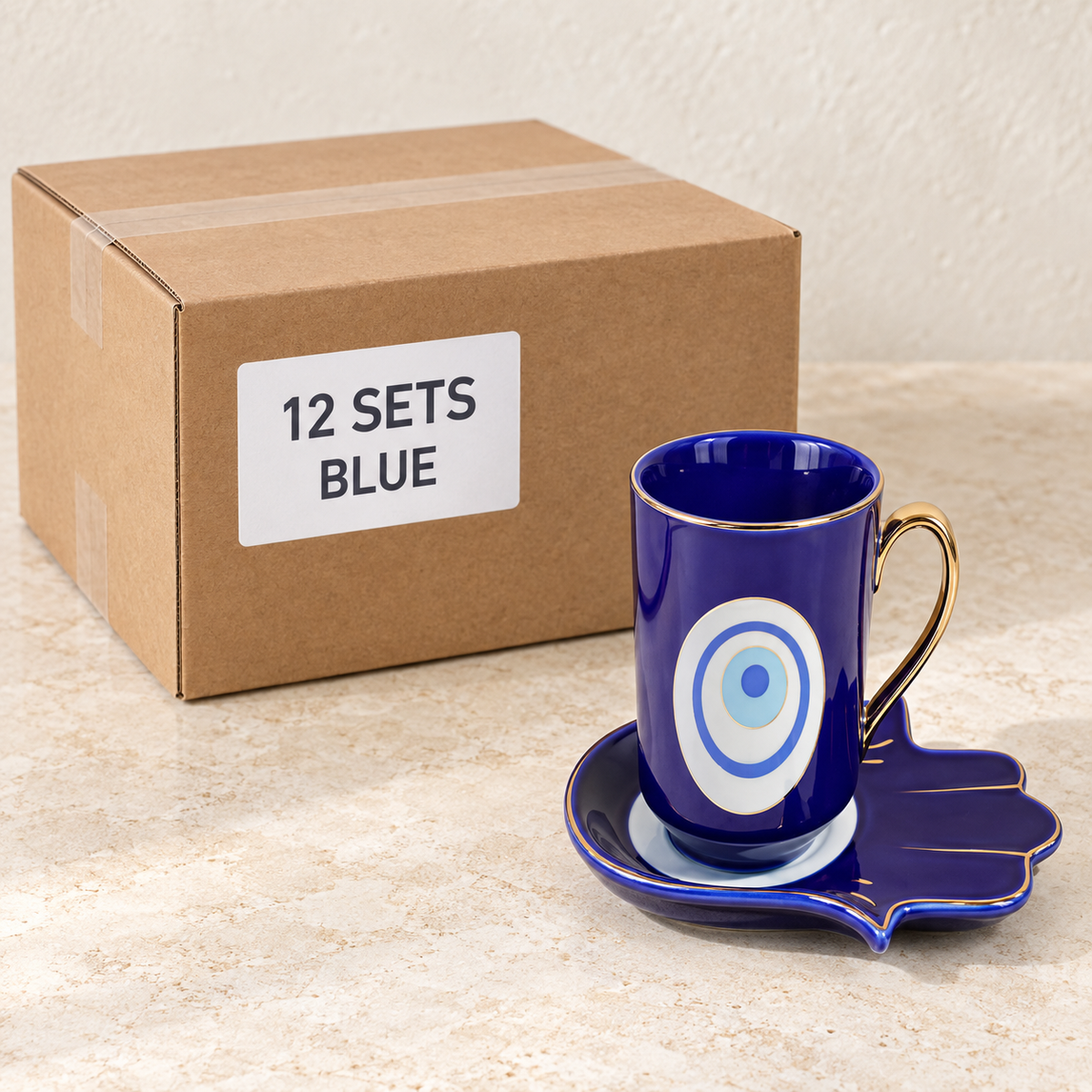 Evil Eye Mugs with Hamsa Trays — Box of 12 — 12 × Blue. Representative samples beside illustrative wholesale carton.