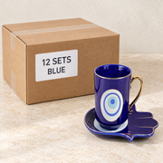 Evil Eye Mugs with Hamsa Trays — Box of 12 — 12 × Blue. Representative samples beside illustrative wholesale carton.