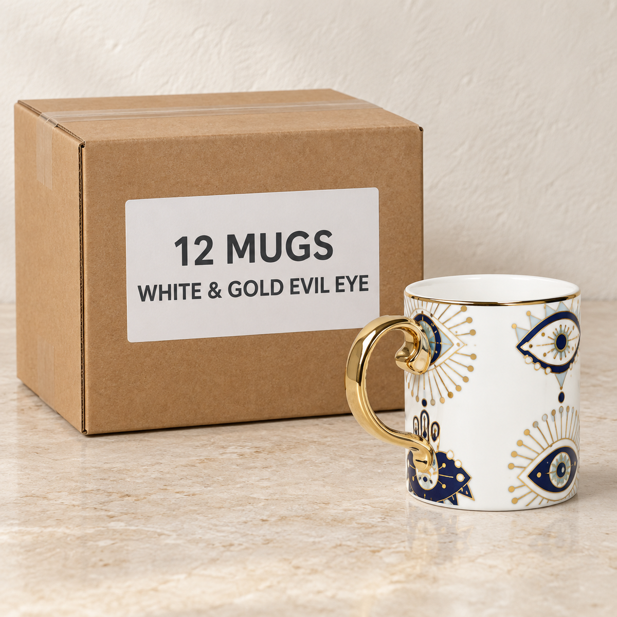 Evil Eye & Hamsa Mugs — Box of 12 — 12 × White & Gold Evil Eye. Representative samples beside illustrative wholesale carton.