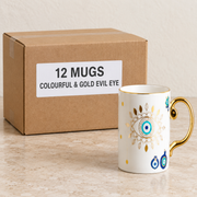 Evil Eye & Hamsa Mugs — Box of 12 — 12 × Colourful & Gold Evil Eye. Representative samples beside illustrative wholesale carton.