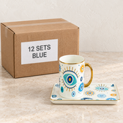 Evil Eye Mugs with Rectangular Trays — Box of 12 — 12 × Blue. Representative samples beside illustrative wholesale carton.