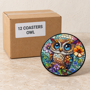 Nature Ceramic Coasters · 10 cm — Box of 12 — 12 × Owl. Representative sample beside illustrative wholesale carton.