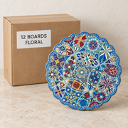Round Tile Serving Boards — Box of 12 — 12 × Floral. Representative samples beside illustrative wholesale carton.