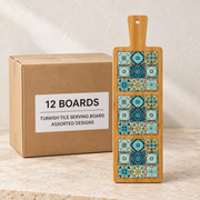 Turkish Tile Serving Boards — Box of 12 — 12 × Turkish Tile Serving Board - Assorted Designs. Representative samples beside illustrative wholesale carton.